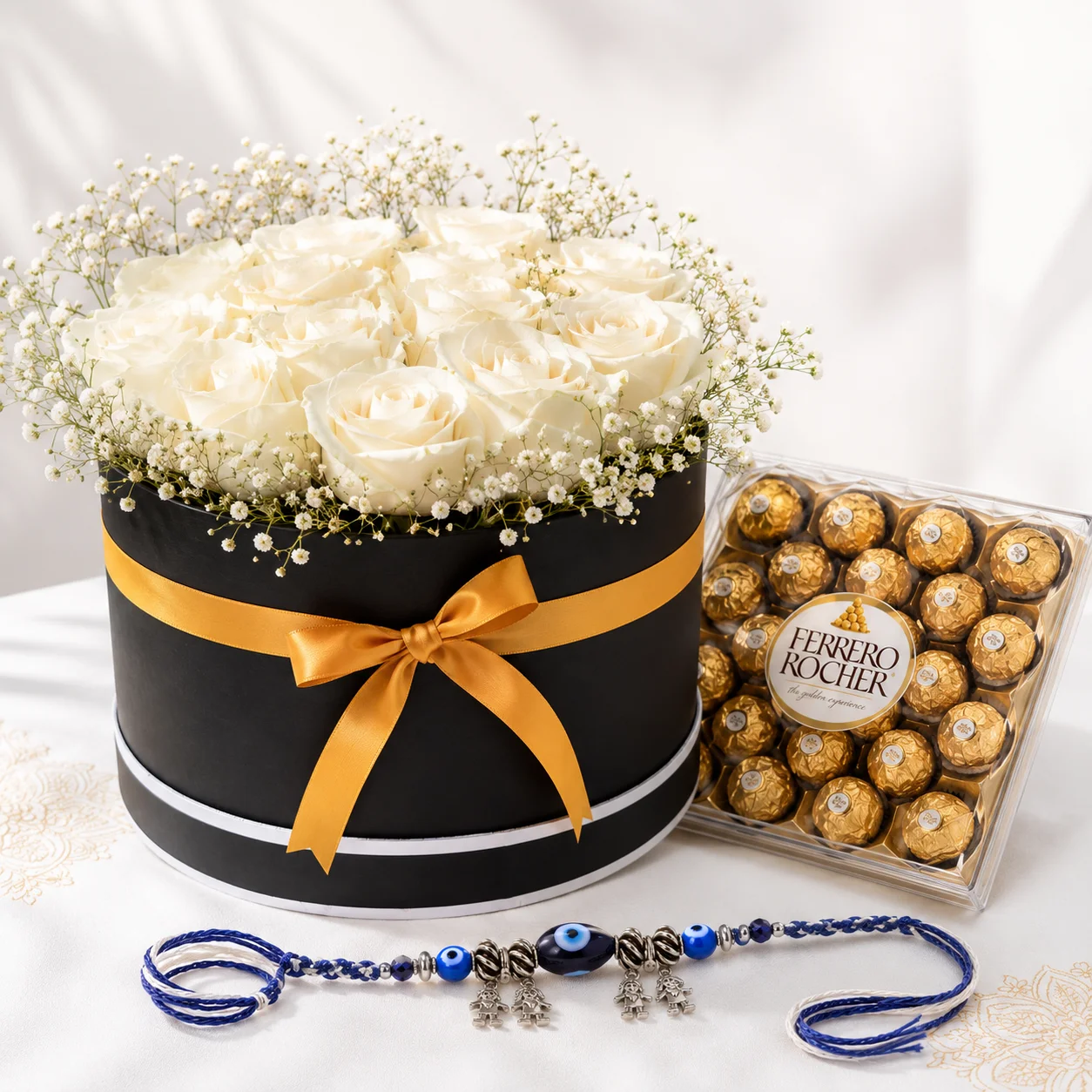 Evil Eye Rakhi with Flowers and Chocolates featuring 21 white roses, Ferrero Rocher chocolates and a stylish Evil Eye rakhi